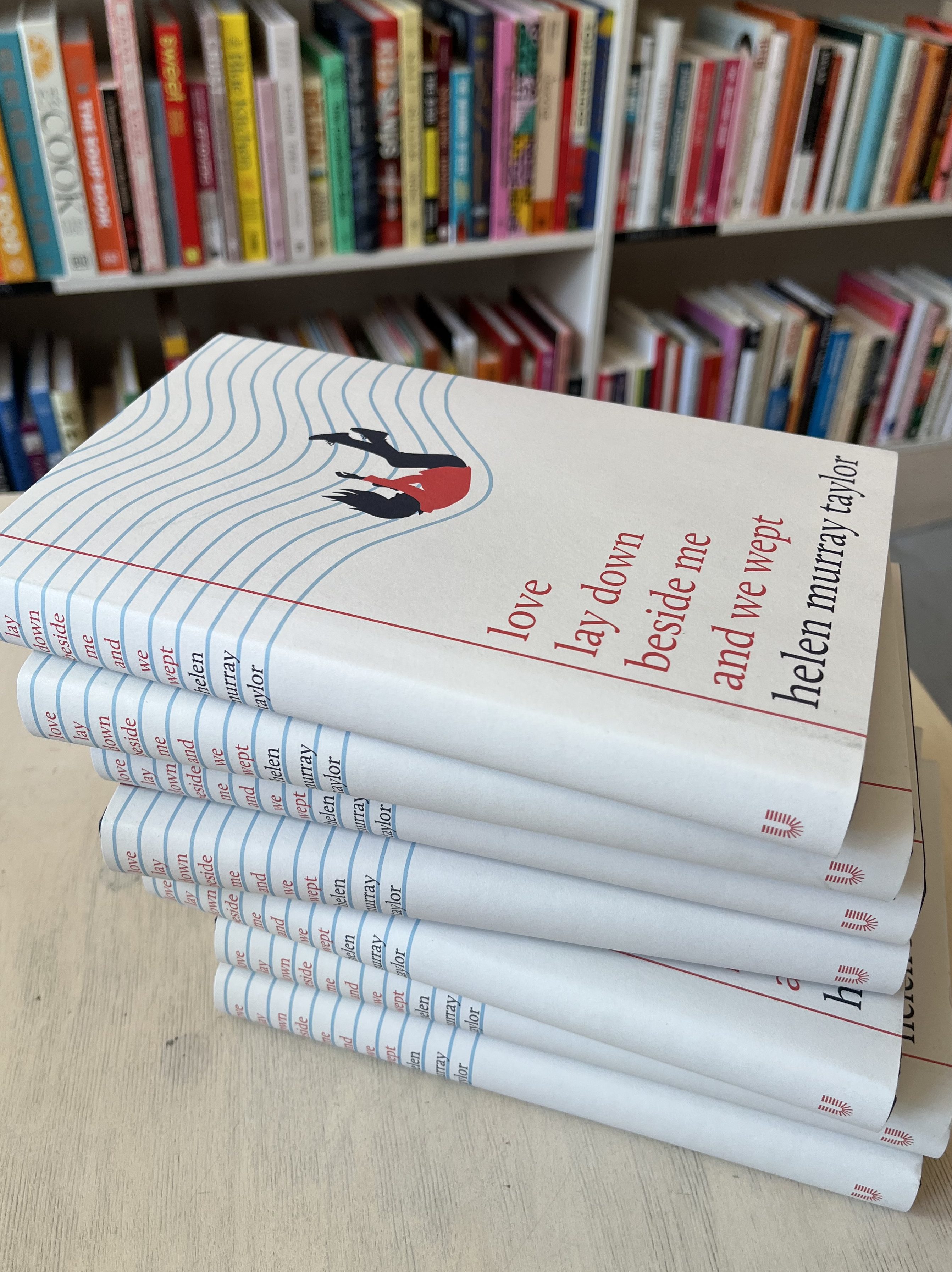 A pile of hard back copies of love lay down beside me and we wept